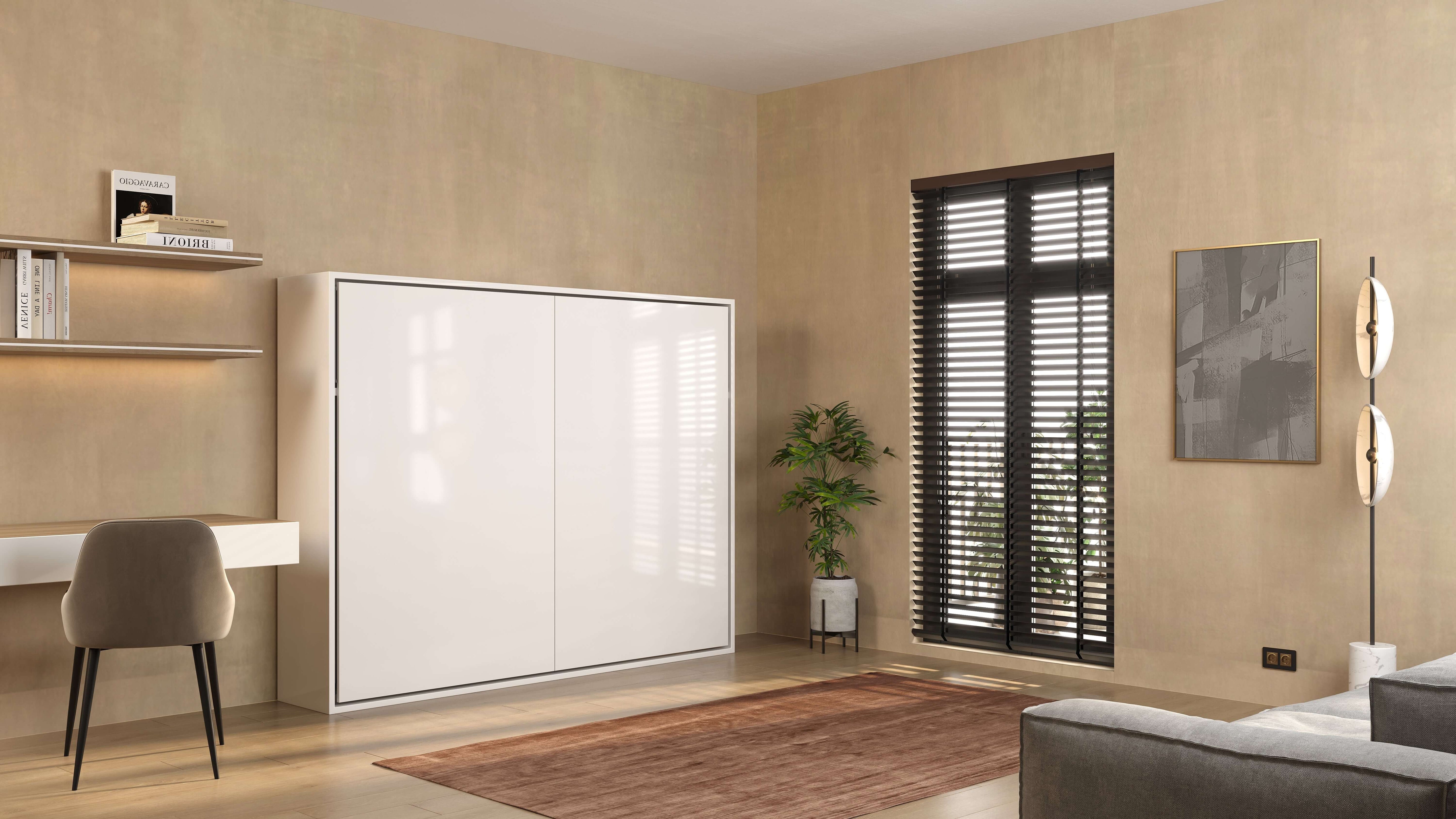 Stijlvol Compaqt Deluxe horizontaal opklapbed in witte kast, perfect voor kleine ruimtes met bureau en planten in de woonkamer.